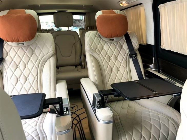 Folding table board installed on the armrest of individual seat in van 1